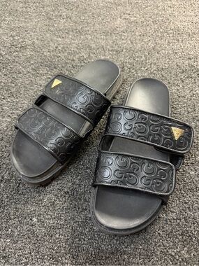 GUESS Women’s Black Embossed Logo Slide Sandals with Gold Accent